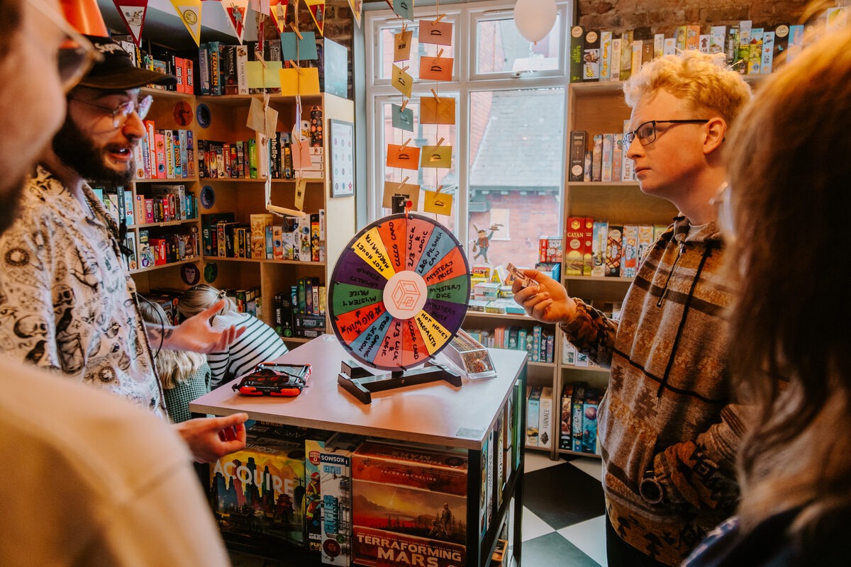 Players gathered around the Spin and Win wheel at Chance and Counters