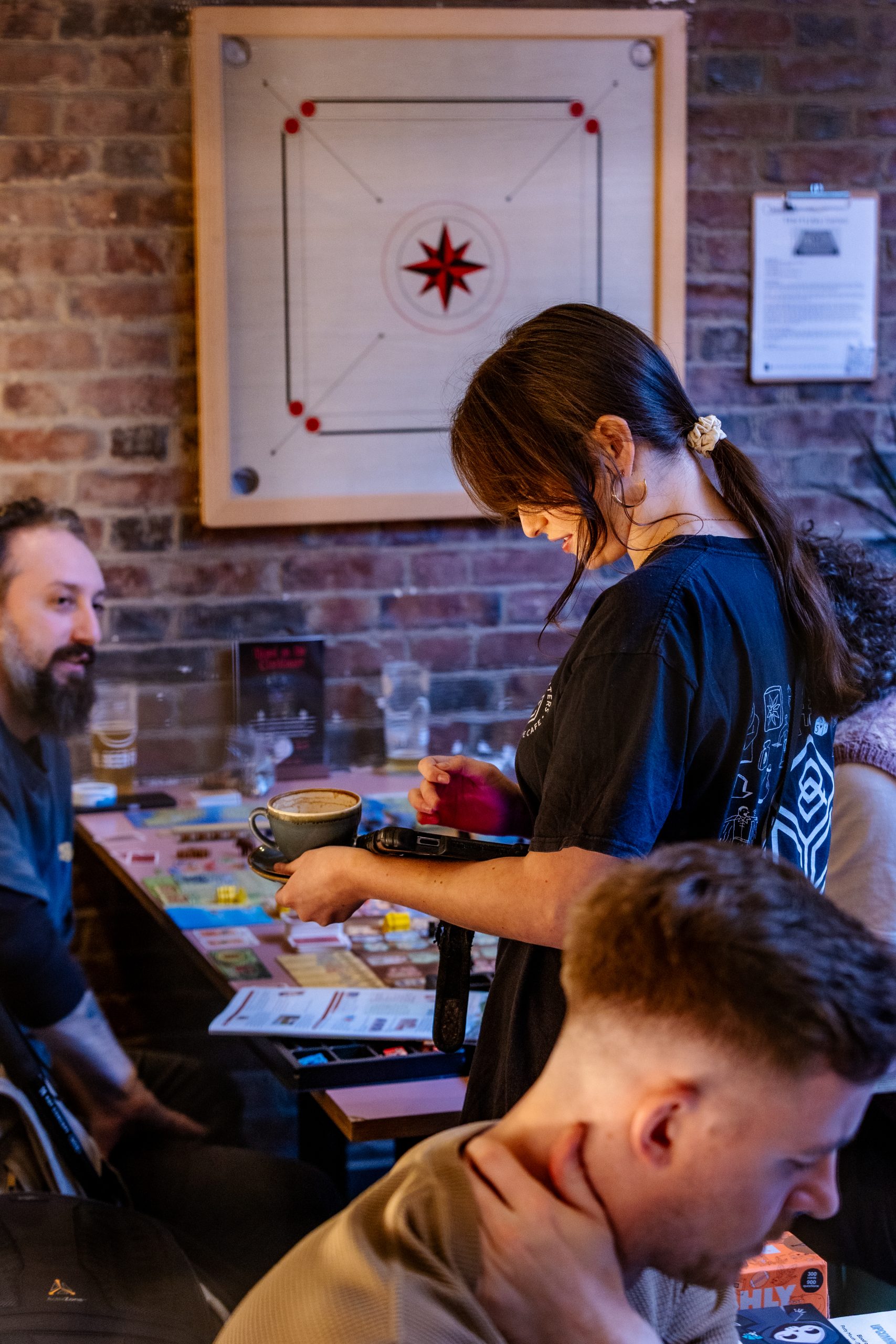 A host teaching a board game to a group