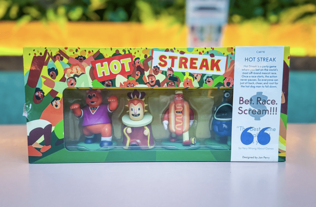 Colorful Hot Streak game box with bold logo, animated characters visible through a clear window, and a vibrant side panel.