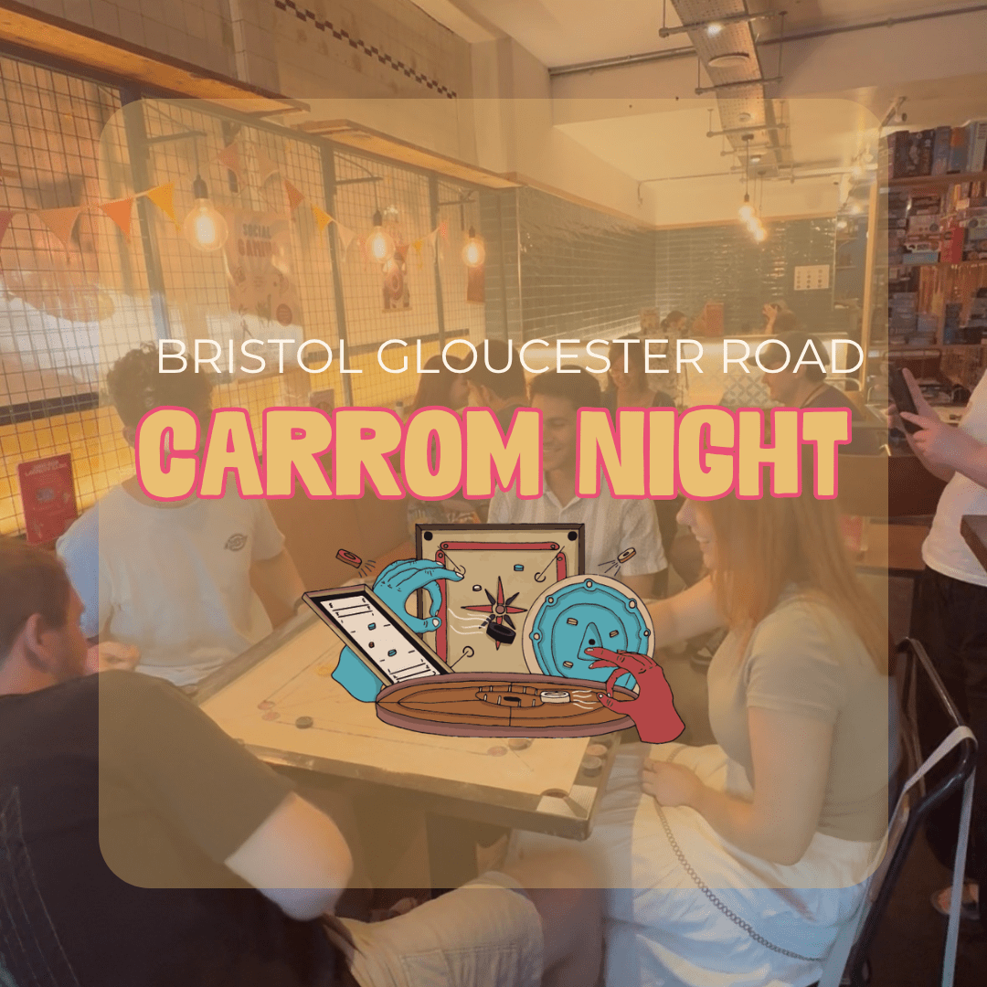 Group of people gathered around a carrom board in a busy cafe on Bristol's Gloucester Road for a Carrom Night event.